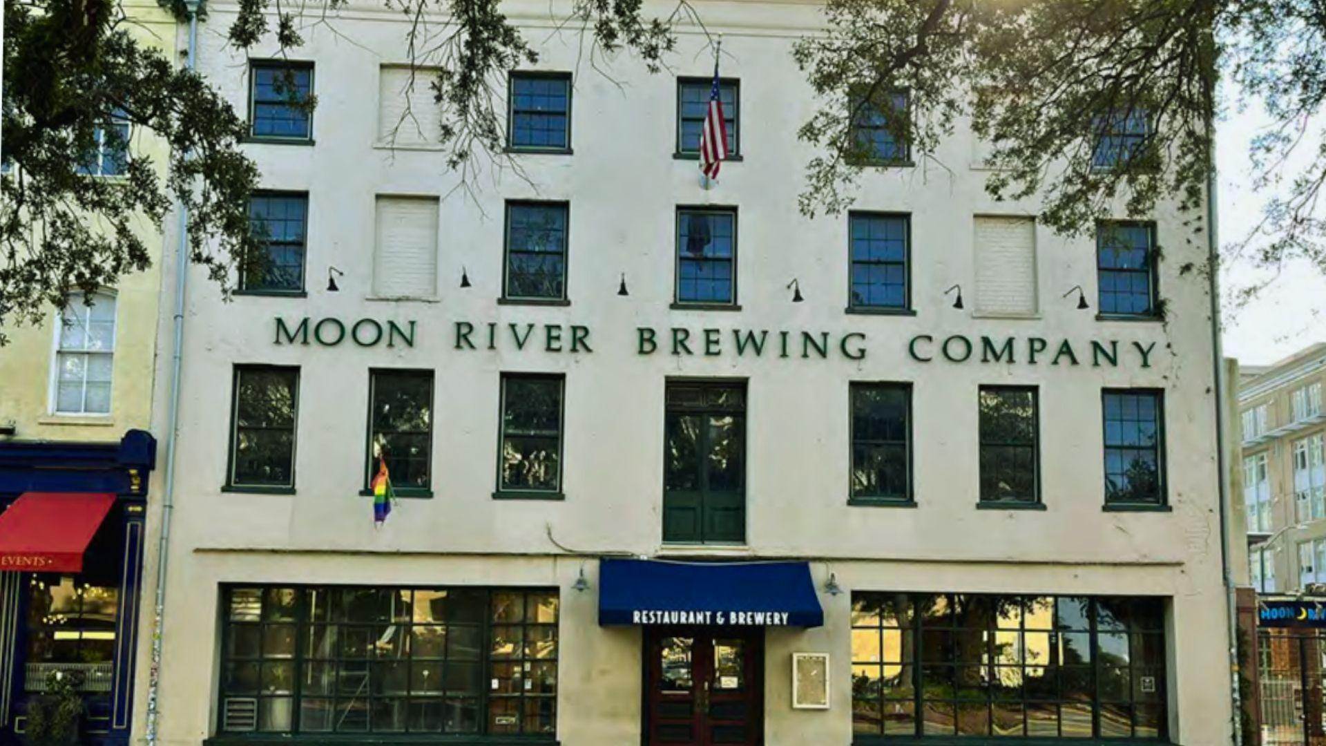 Historic brick Moon River Brewing Company building with outdoor seating in downtown Savannah