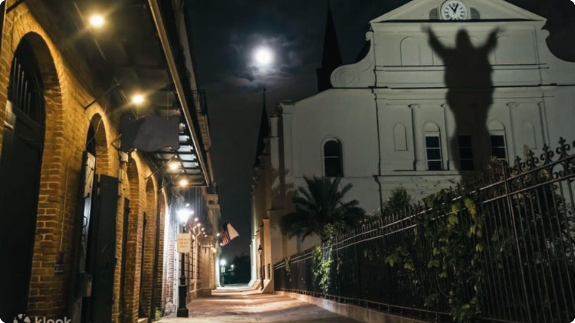 Spooky ghost tour scene on haunted French Quarter street at night, popular paranormal walk in New Orleans