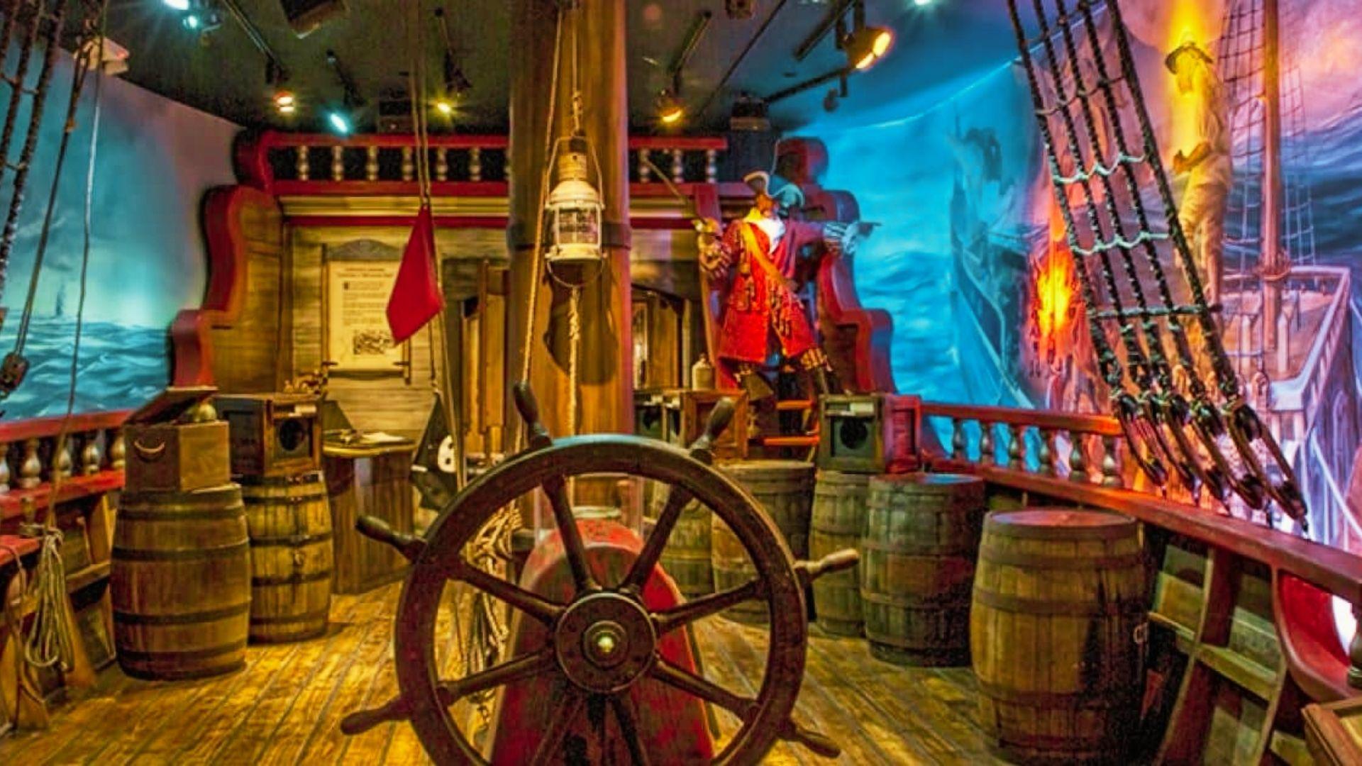 Inside a pirate ship, highlighting a wooden barrel that reflects the ship's adventurous past.
