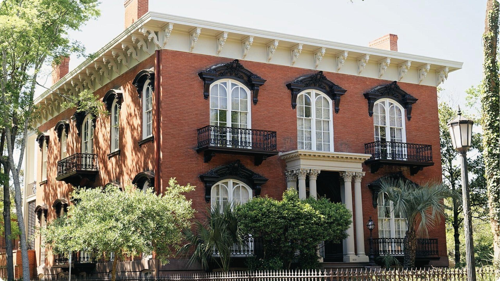 Mercer Williams House red brick Italianate mansion with balconies, iconic stop on Savannah walking tour map