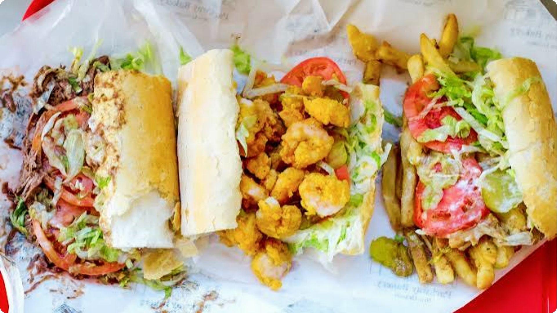Three authentic po-boy sandwiches with fried shrimp and roast beef, iconic street food in French Quarter