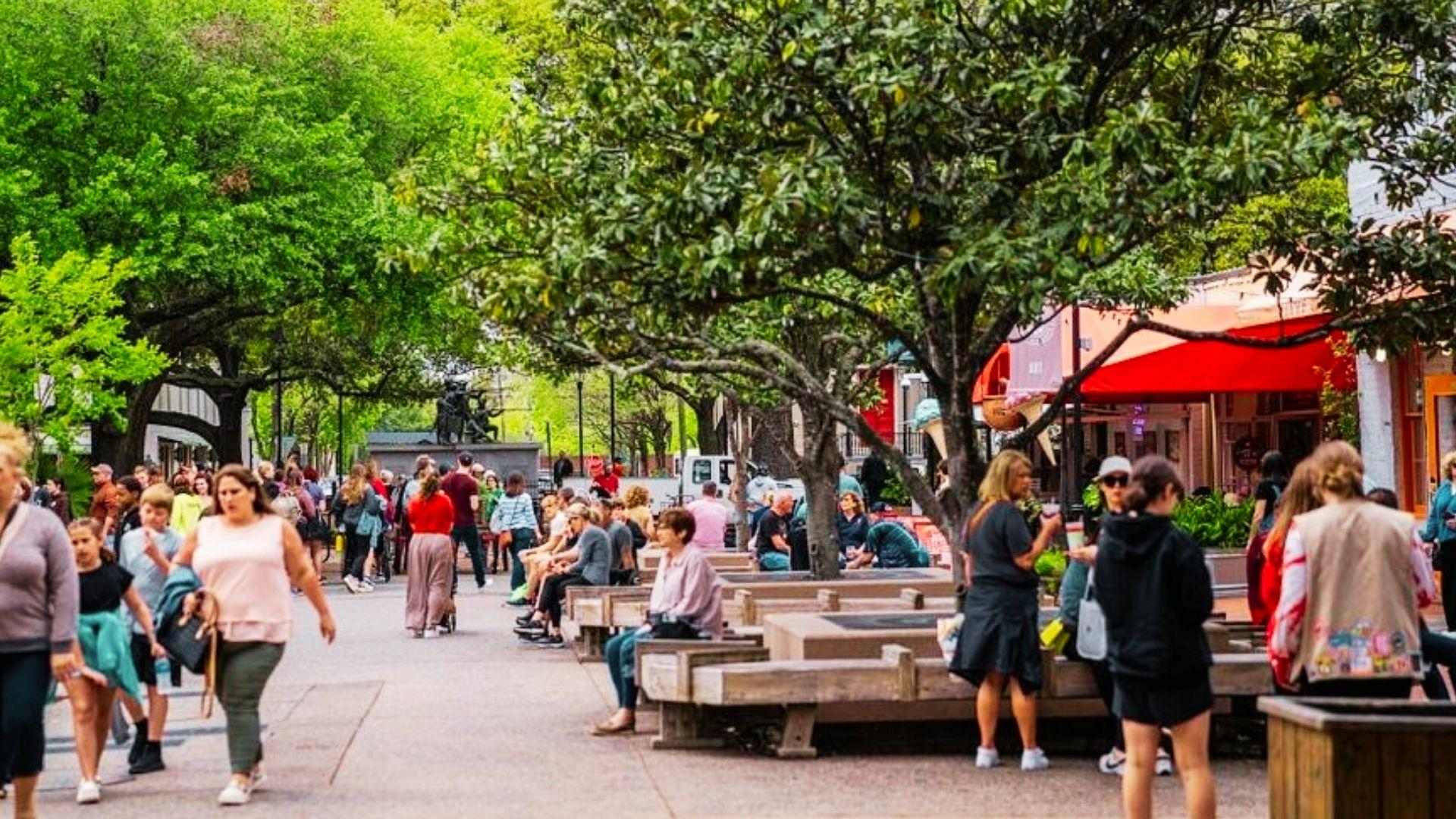 people enjoying walking through the city market in Savannah.