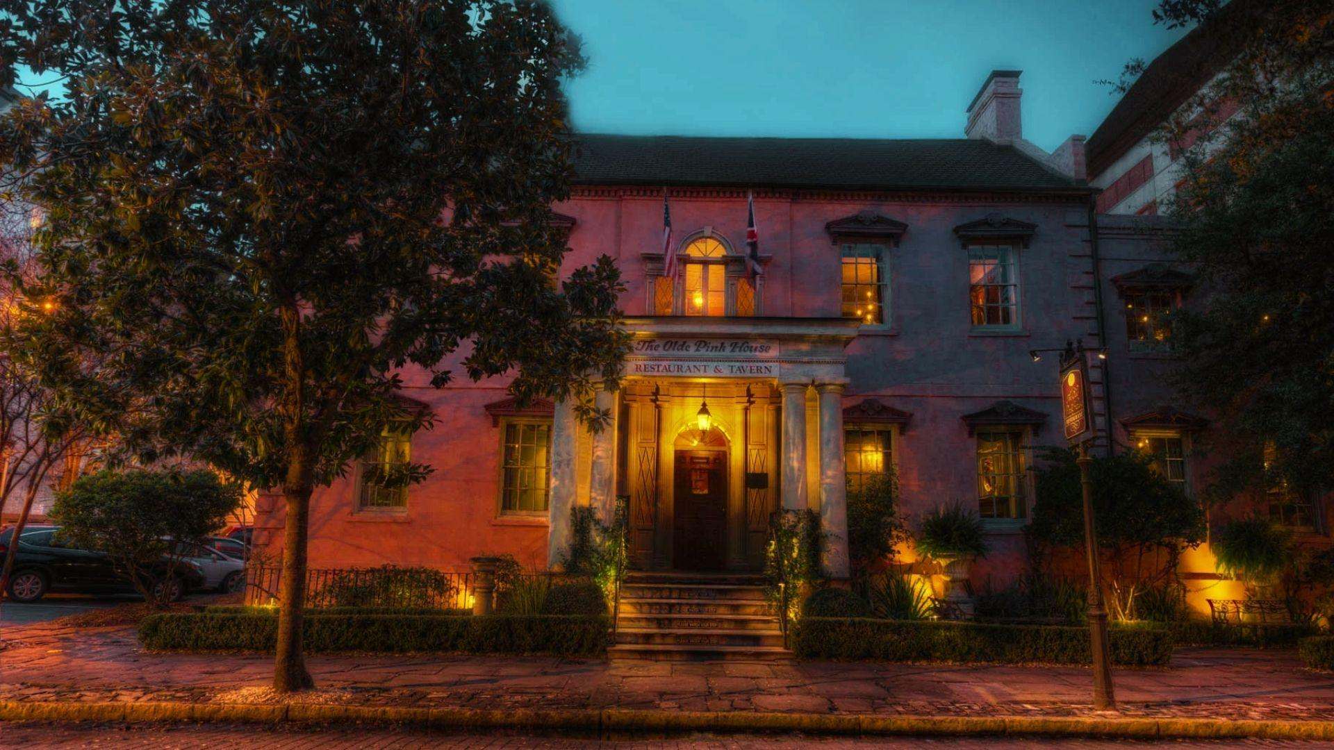 image of The Olde Pink House at night.