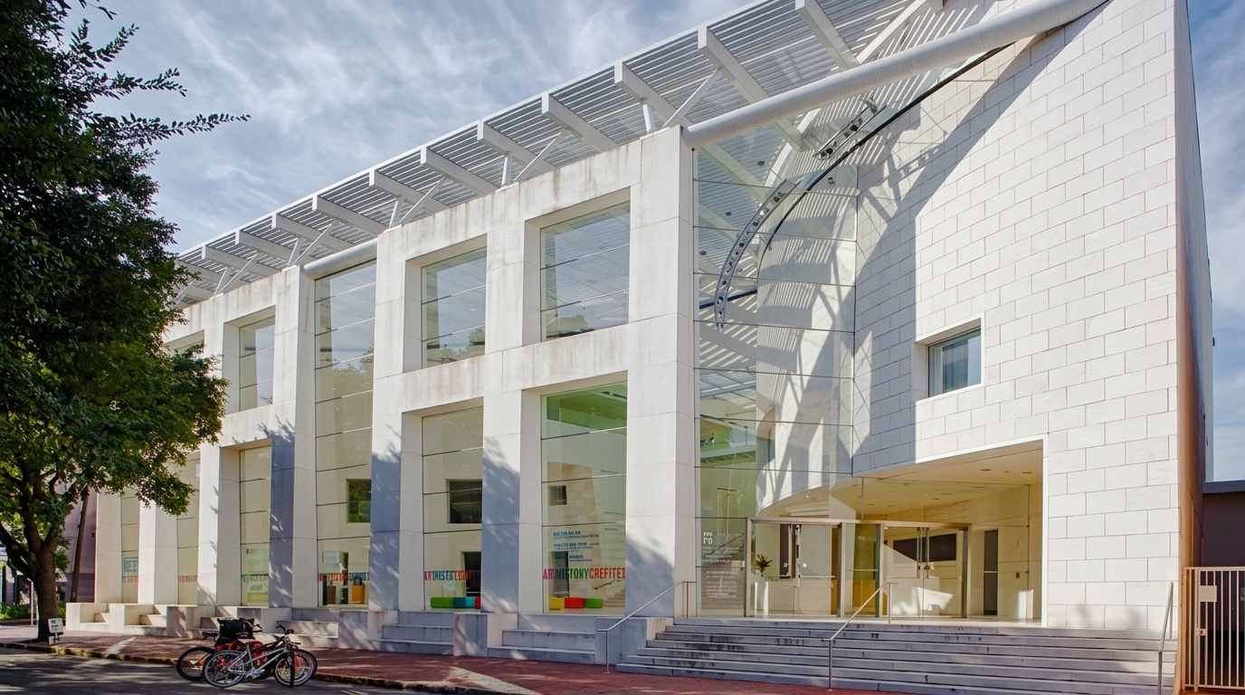 Jepson Center in Savannah, modern white building with tall glass windows and stone steps.

