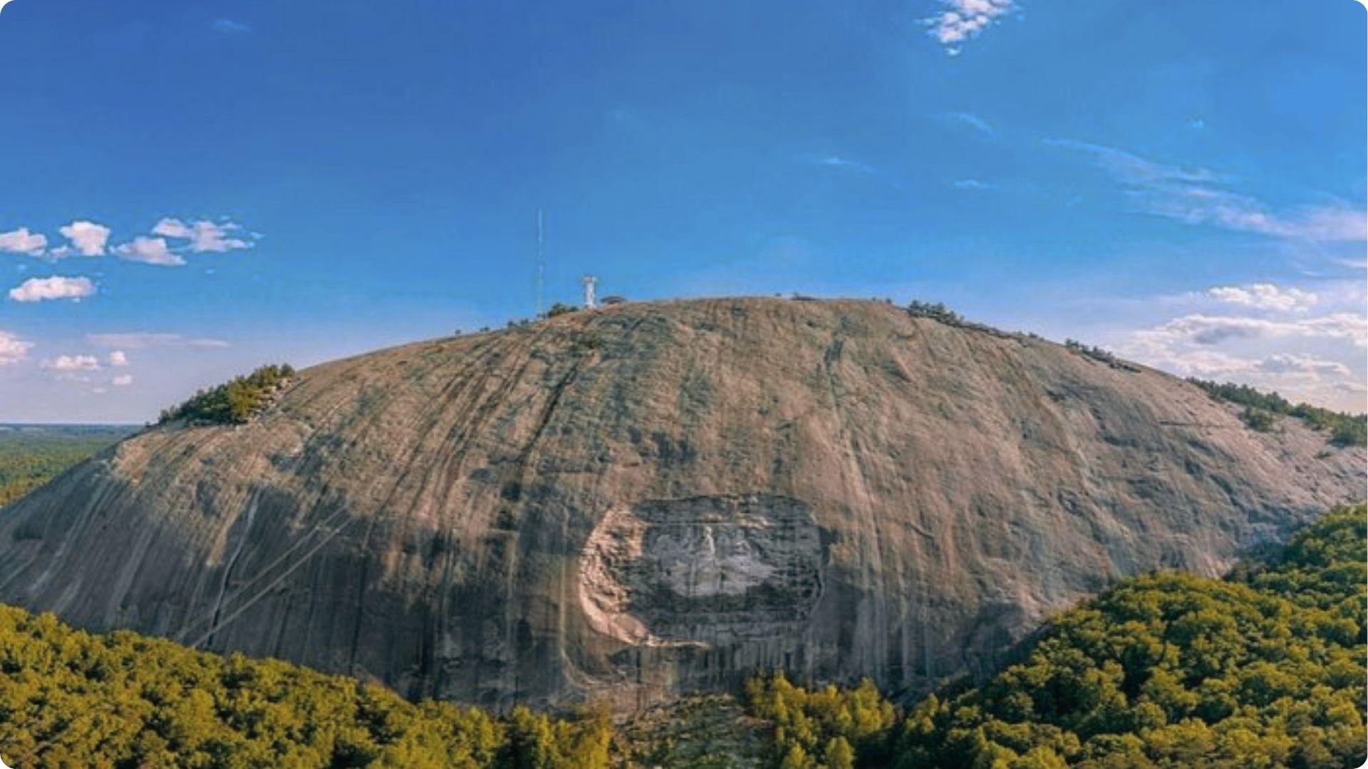Stone Mountain granite peak with massive carving above forest, iconic outdoor day trip from Atlanta.