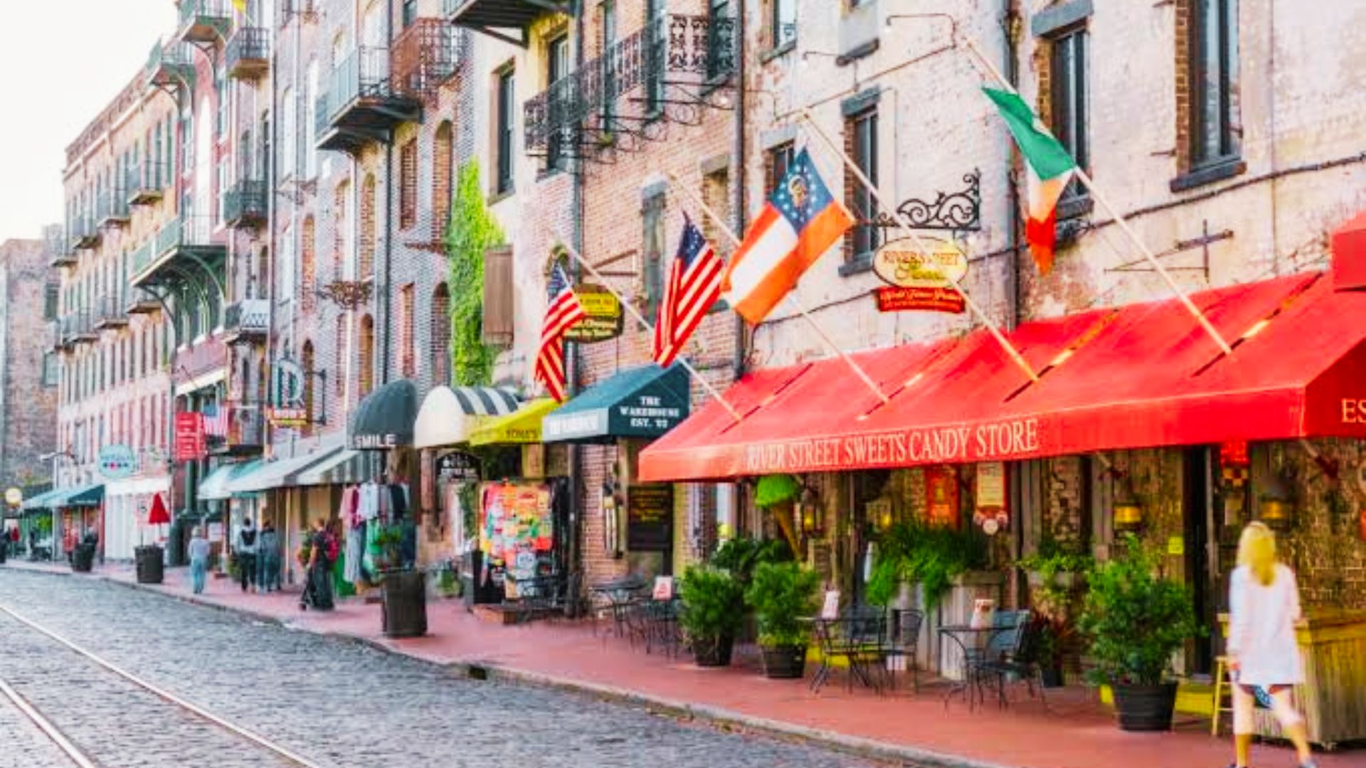 Colorful shops and flags along historic River Street in Savannah