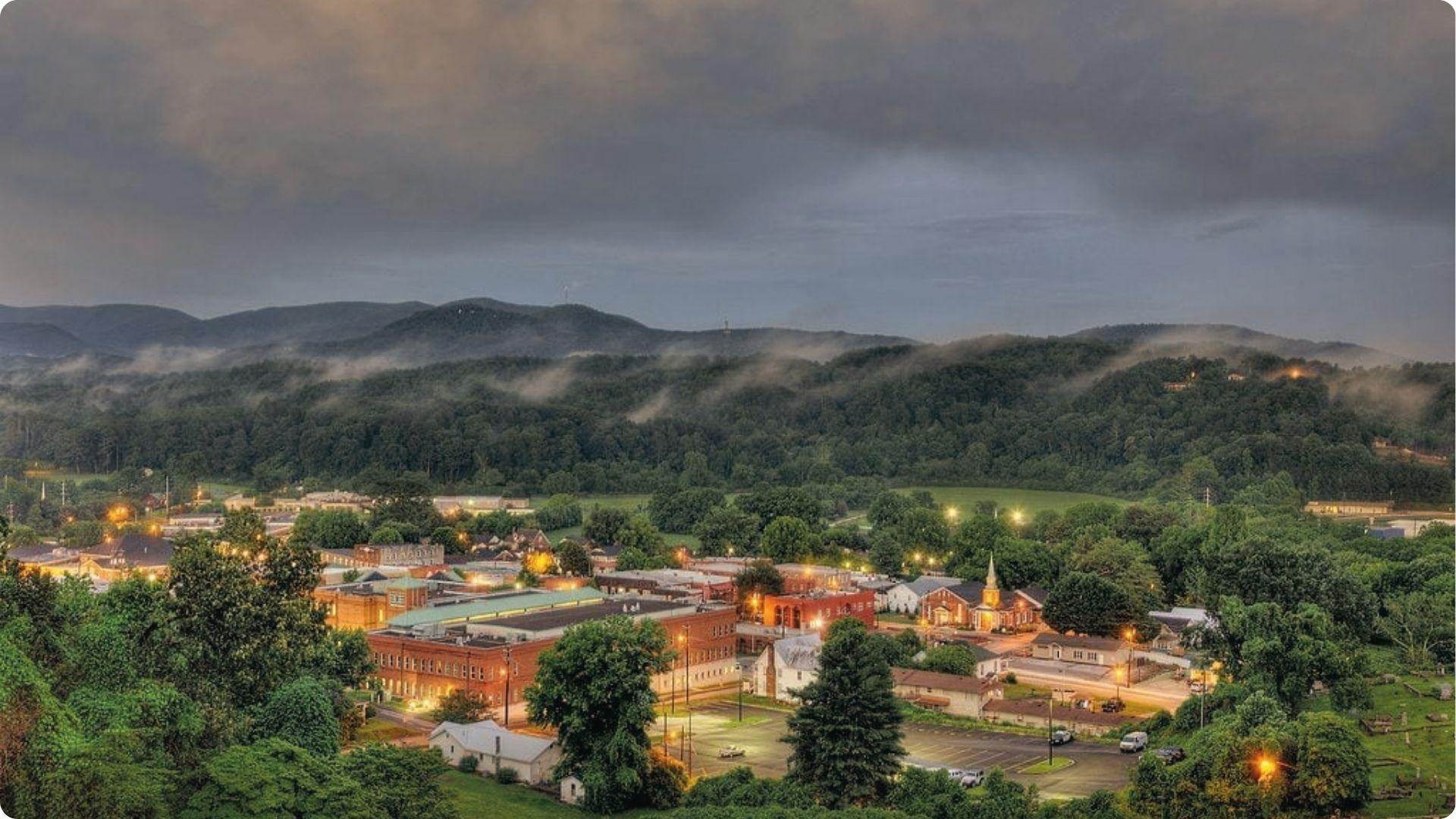 Ellijay is a mountain town glowing at dusk among green hills, a perfect peaceful day trip from Atlanta.