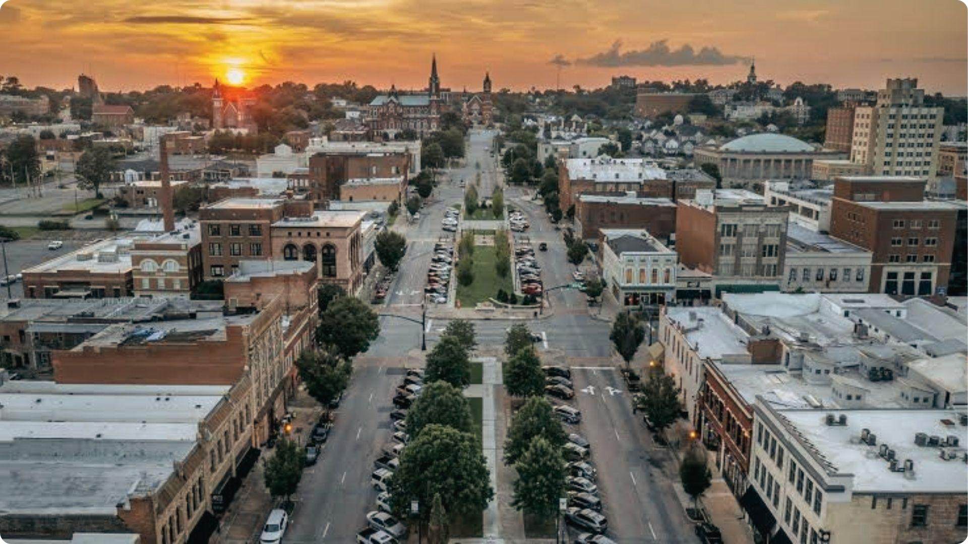 Downtown Macon sunset view over historic brick buildings, charming cultural day trip from Atlanta.