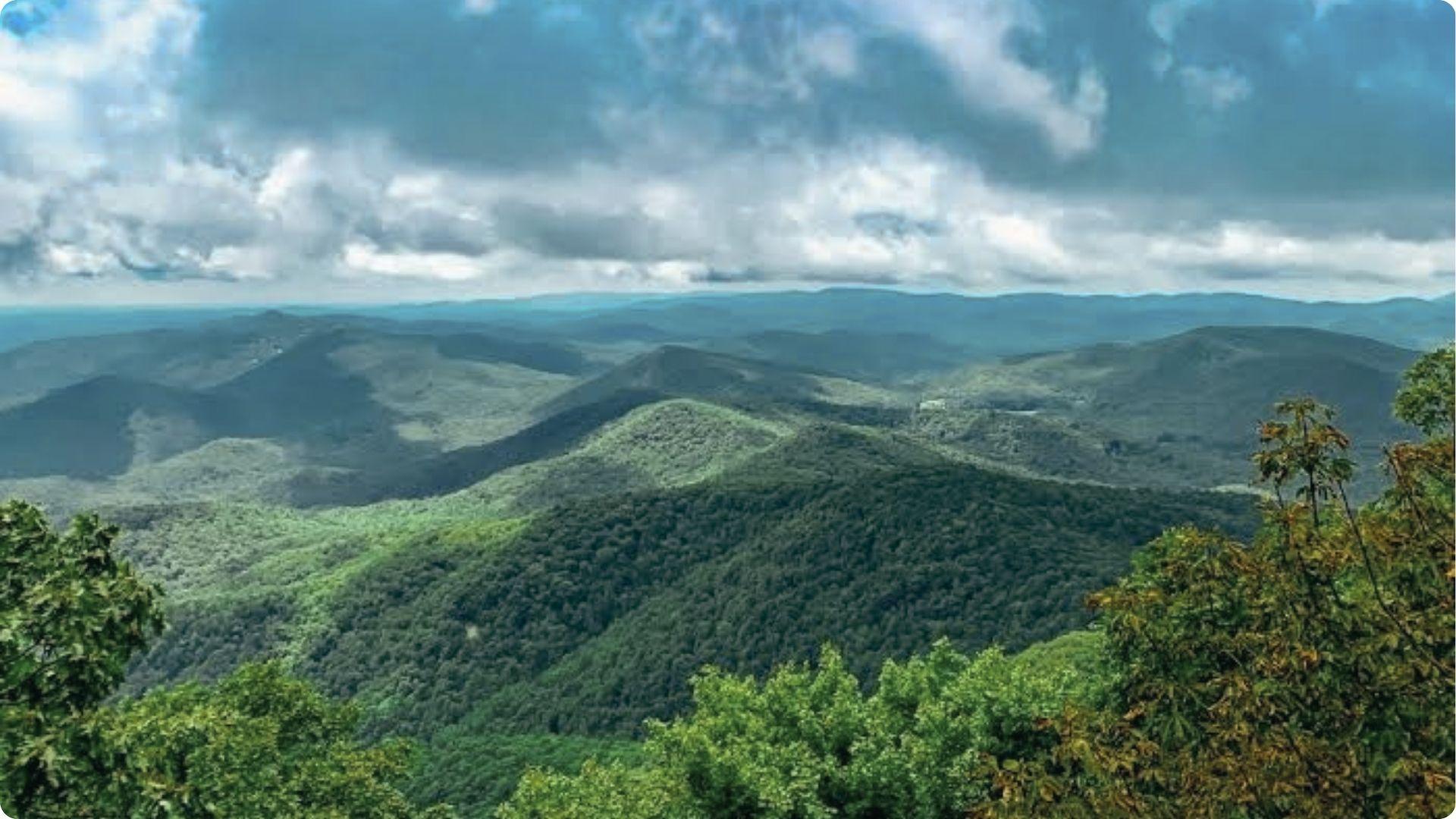 Brasstown Bald overlooks endless green Appalachian hills, scenic mountain day trip from Atlanta.